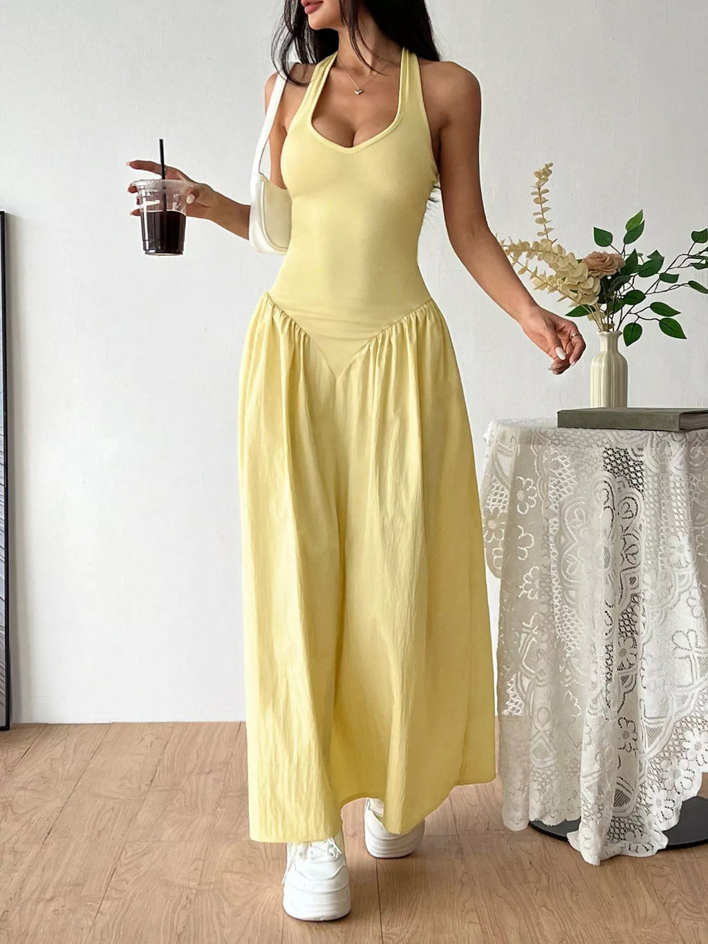 Halter neck ruched maxi dress by Shopimist featuring a flowing silhouette and gathered fabric for a stylish, elegant look.