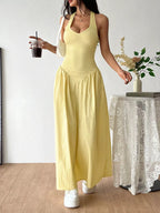 Halter neck ruched maxi dress by Shopimist featuring a flowing silhouette and gathered fabric for a stylish, elegant look.