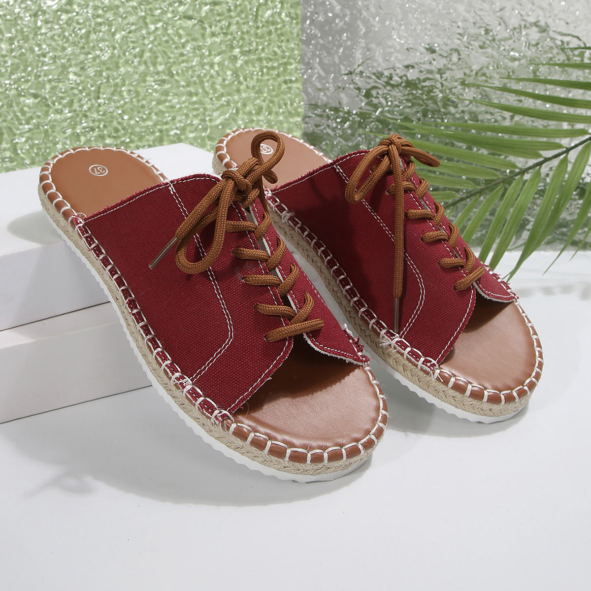 Women's faux leather lace-up open toe flat sandals by Trendsi, featuring a stylish design and comfortable fit.