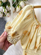 Shopimist smocked floral top and skirt set featuring a lightweight, feminine design with vibrant flower patterns and ruffled details.