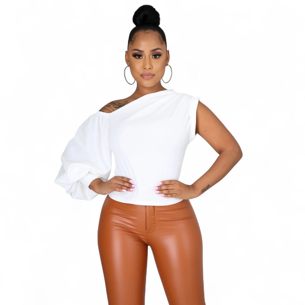 The House of Stylez one shoulder puff sleeve blouse in soft fabric, featuring a stylish asymmetrical design and ruffled sleeve detail.
