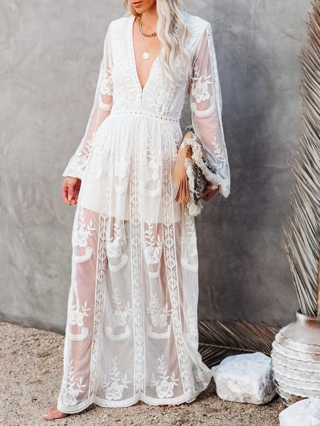 Elegant floral lace high-slit maxi dress by Trendsi featuring intricate lace details and a flowing silhouette for formal occasions.