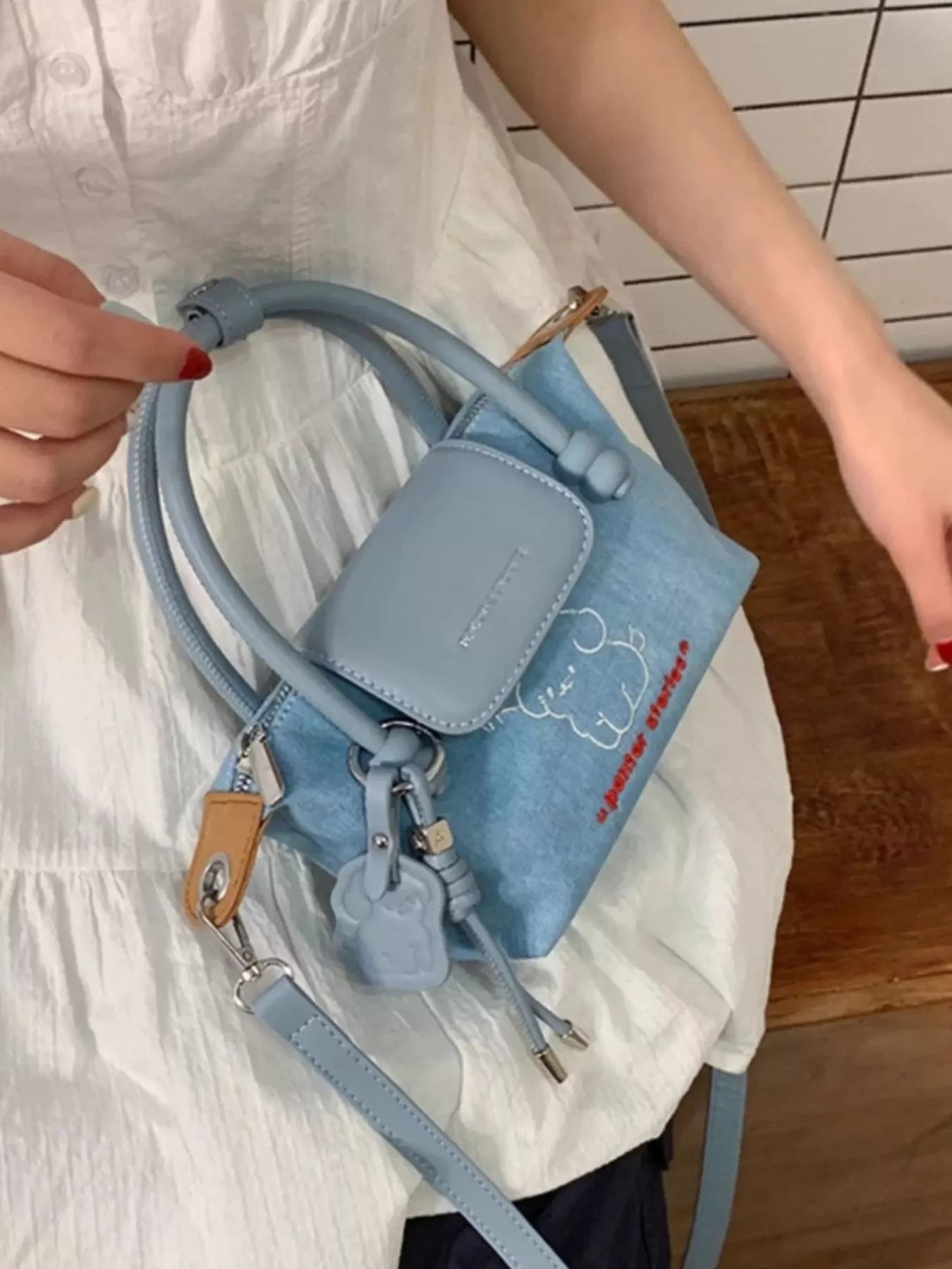Denim handbag with embroidered puppy design by Plush Fashion Hub, featuring a stylish and casual bag for everyday use.