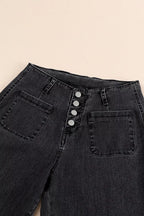 High-waisted button-fly wide-leg jeans by Trendsi, featuring a classic denim look with relaxed fit and stylish design.