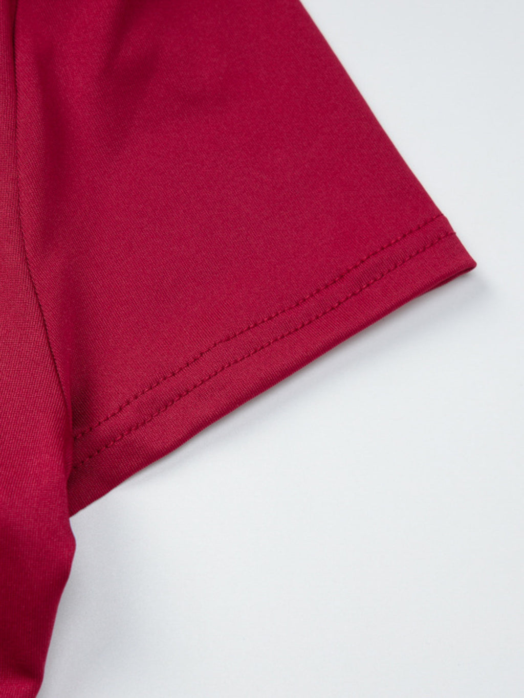Women's fitted one-shoulder T-shirt with button accents, stylish and trendy from Trendsi, shown in a close-up view.