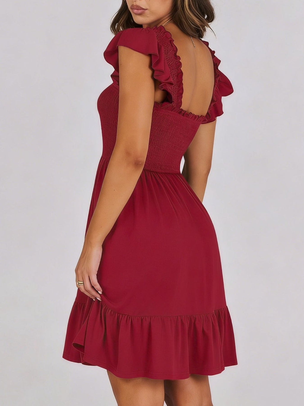 Women's smocked ruffle hem mini dress by Trendsi, casual lightweight summer dress with a fitted bodice and flowy ruffle hem.