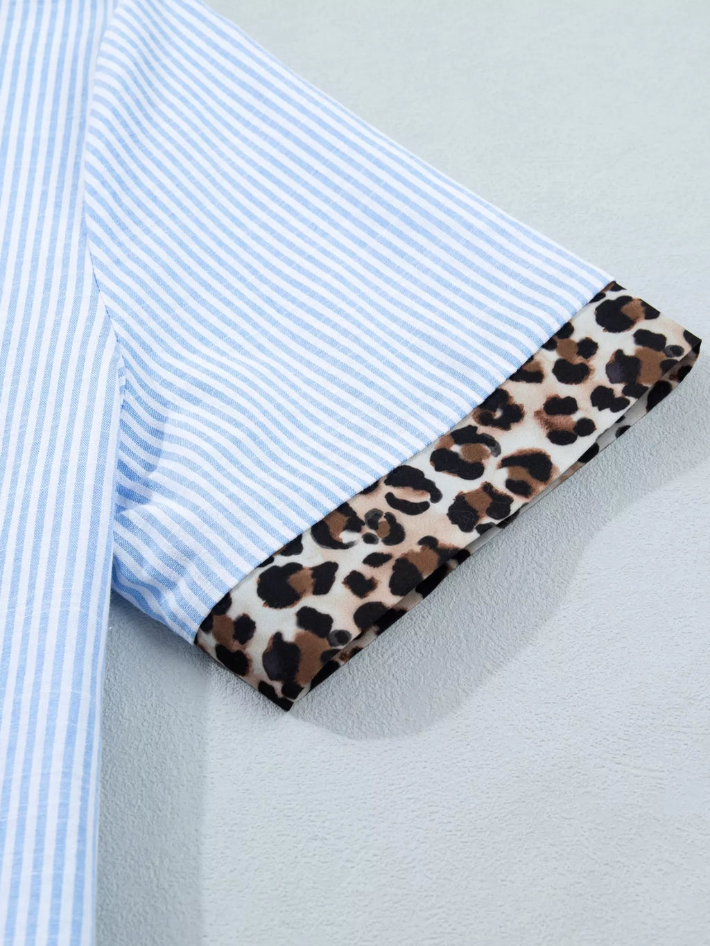 Women's leopard print short sleeve dress with contrast collar by Plush Fashion Hub, stylish and lightweight for casual wear.