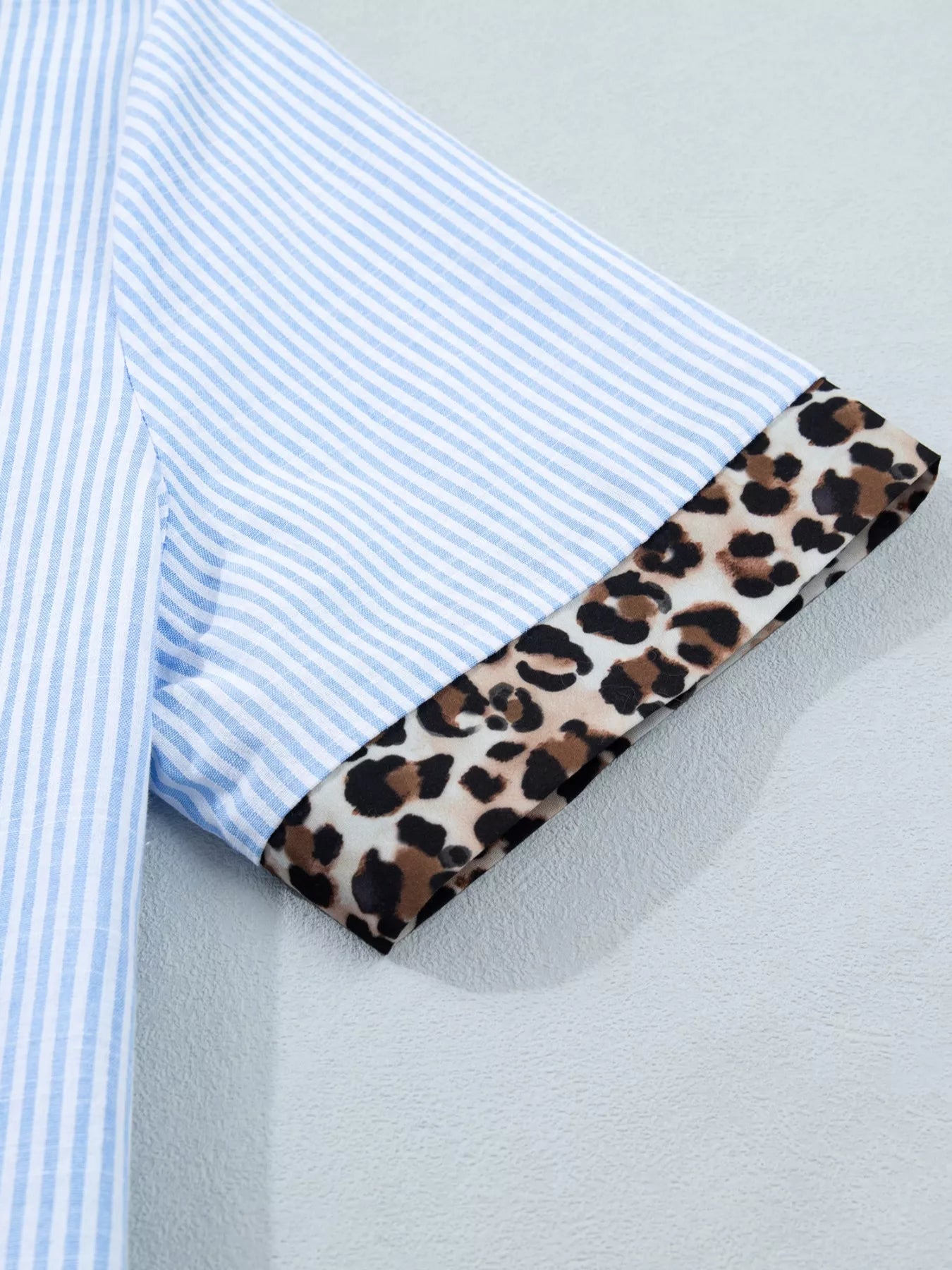 Women's leopard print short sleeve dress with contrast collar by Plush Fashion Hub, stylish and lightweight for casual wear.