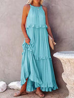 Ruffled tiered sleeveless maxi dress in flowing fabric, stylish design by Plush Fashion Hub, perfect for summer occasions