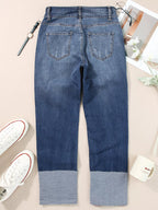 High waist distressed straight leg jeans by Trendsi, showing fit and rips, styled on a model with casual footwear.