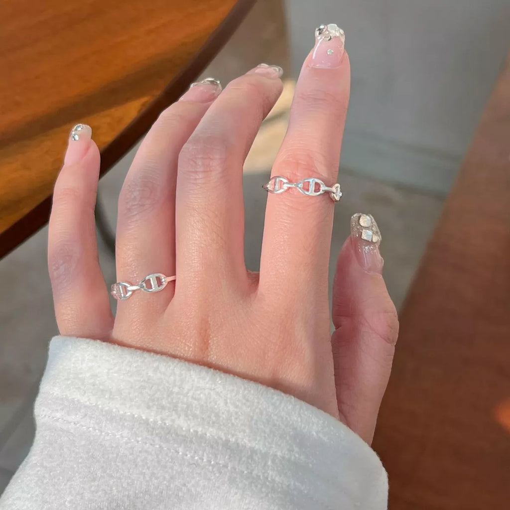 Sterling silver geometric ring with modern design, crafted from 925 sterling silver, featuring clean lines and contemporary style.