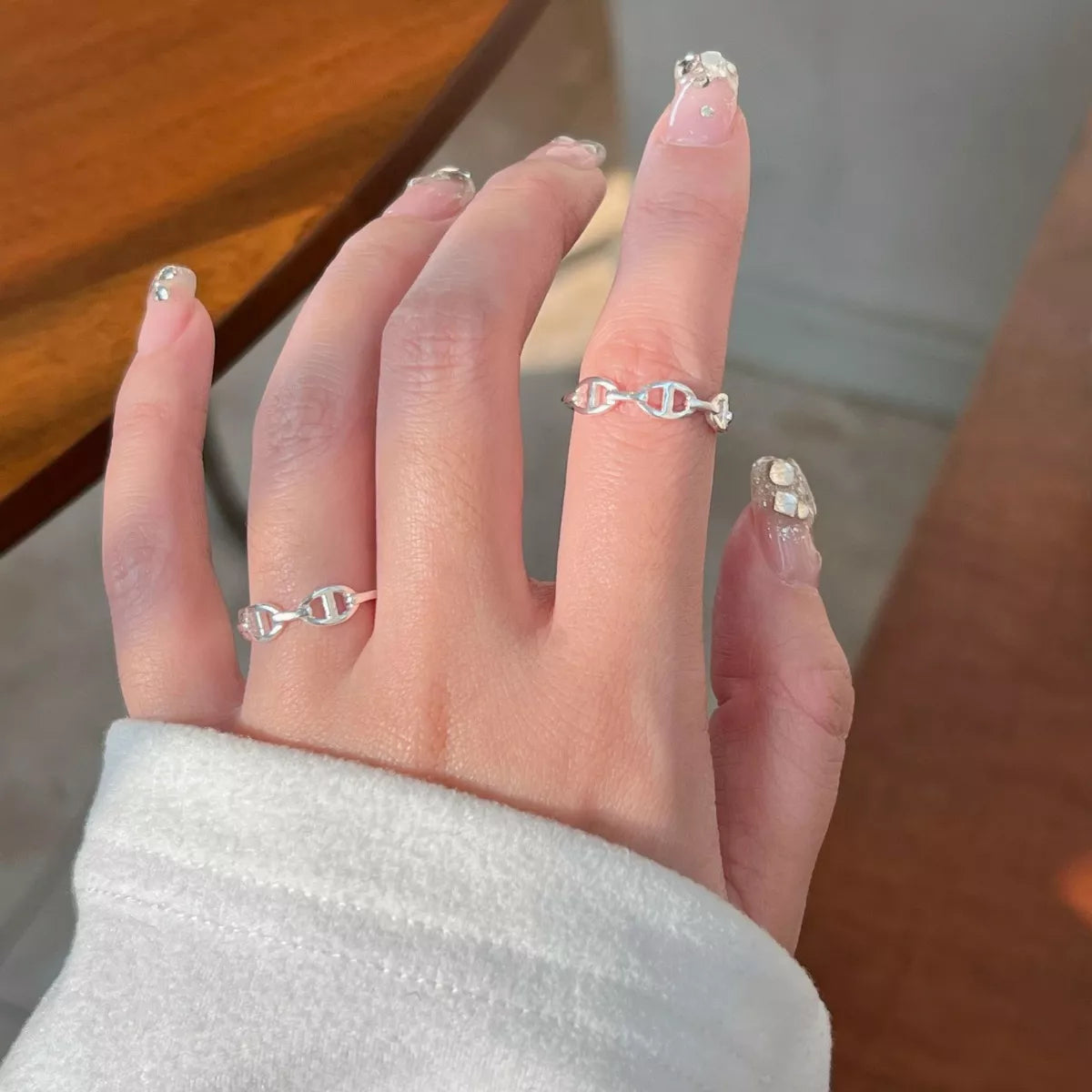 Sterling silver geometric ring with modern design, crafted from 925 sterling silver, featuring clean lines and contemporary style.