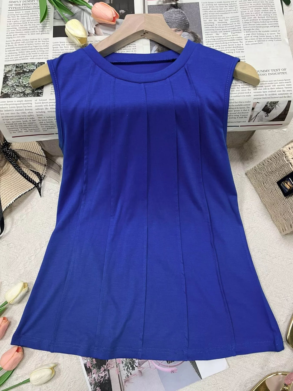 Trendsi round neck tank top, sleeveless tops in soft fabric, shown in a light color with a fitted, casual design.