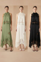 Plush Fashion Hub V-neck ruffle waist tank top and skirt set, elegant hollow-out two-piece casualwear ensemble on model.