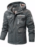 Men's plus size hooded outdoor windproof coat by Shopimist, showing the black windbreaker with hood and front zipper.