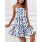 Floral print smocked mini dress by FitiqueFit with spaghetti straps, slim fit, and flowy silhouette, perfect casualwear.