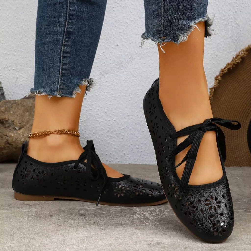 Plush Fashion Hub floral cutout tied slip-on sandals with open toes and decorative flower accents, perfect for casual summer wear.