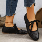Plush Fashion Hub floral cutout tied slip-on sandals with open toes and decorative flower accents, perfect for casual summer wear.