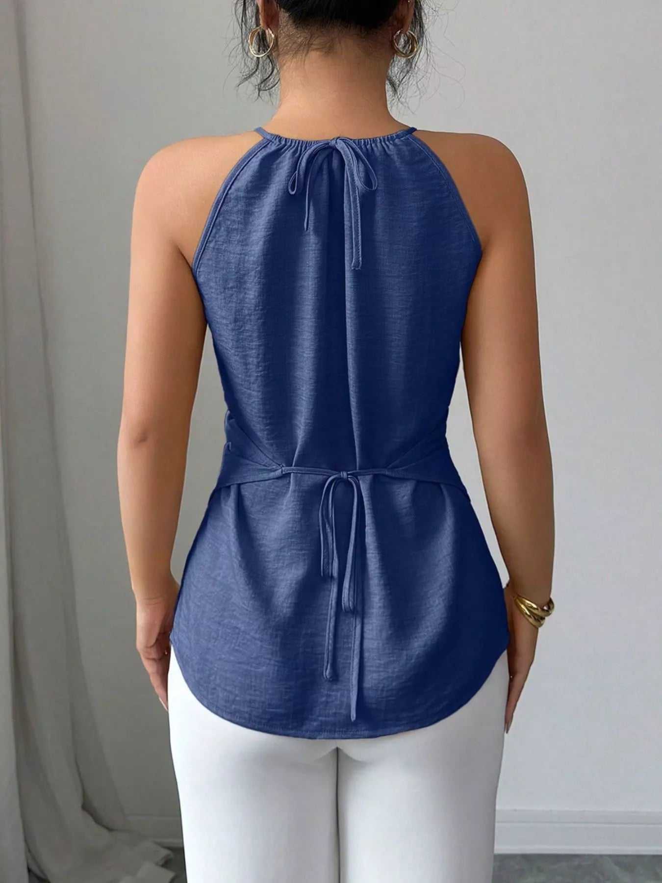 Plush Fashion Hub halter neck crisscross cami tank top in black, featuring a stylish neckline and fitted design.