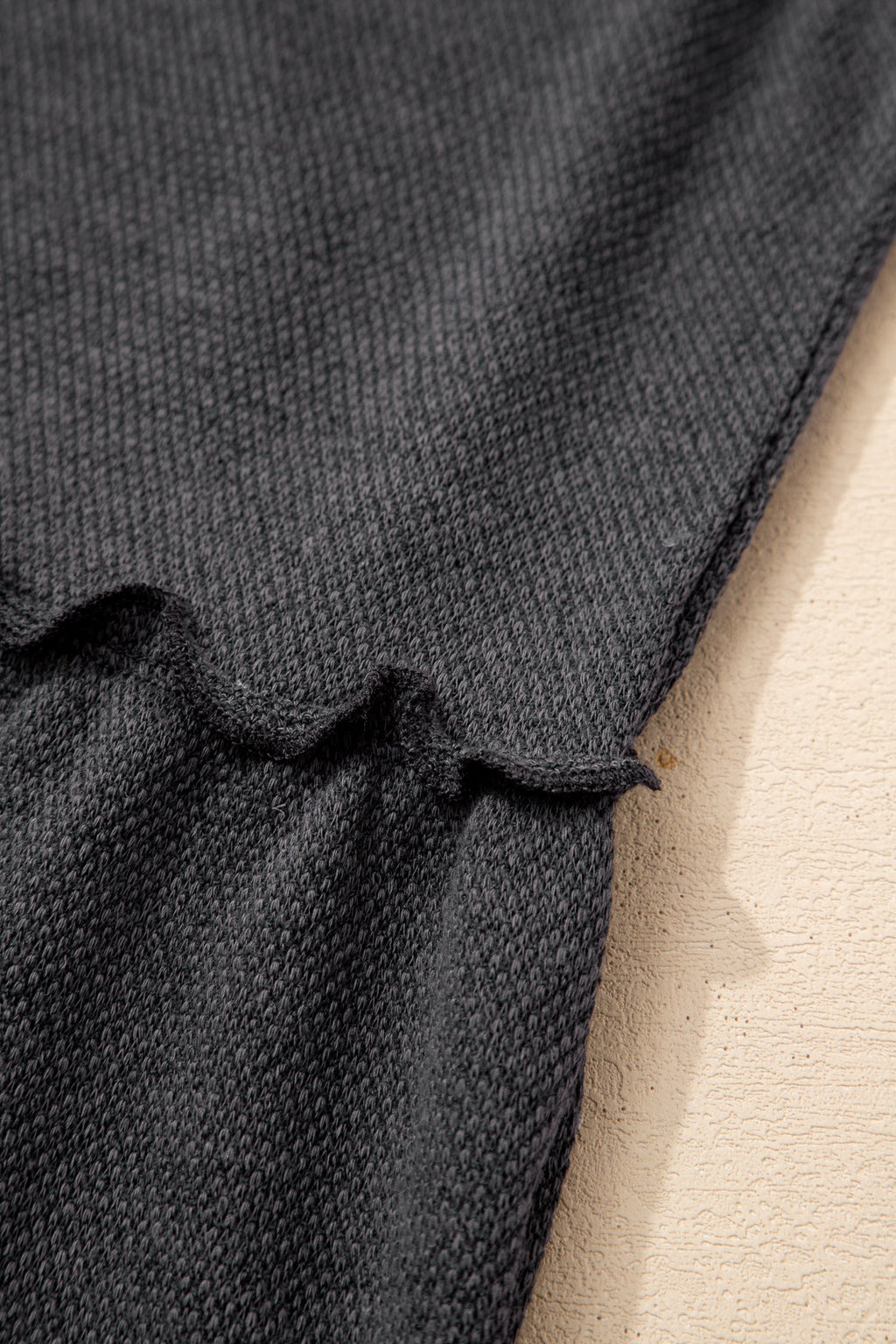 Light blue Macie a Line Tank Top by Threaded Pear displayed on a hanger, showcasing its fitted design and soft fabric.