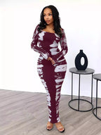 Colorful tie-dye long sleeve maxi dress by Shopimist featuring a flowing design and vibrant patterns.
