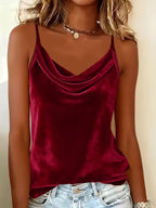 Solid color sleeveless camisole tank top in various colors, casualwear by Plush Fashion Hub, shown on a hanger.
