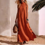 FitiqueFit sleeveless midi dress with side slits and a loose fit, shown on a model in a casual outdoor setting.