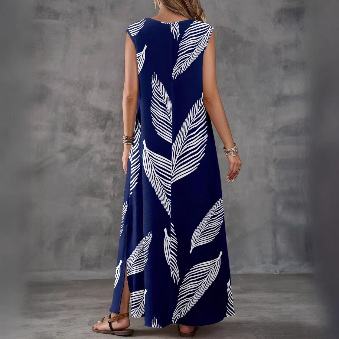 Printed V-neck sleeveless high-waist maxi dress by FitiqueFit in three colors, showcasing its flowing fabric and stylish design.