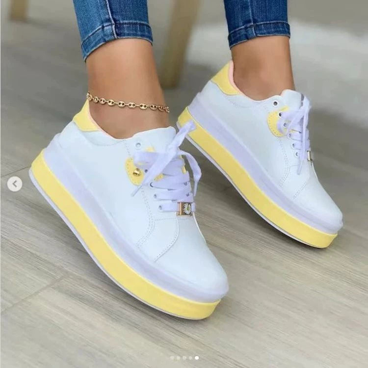 Lace-up platform sneakers in white with chunky soles, stylish footwear by Trendsi, featuring a modern, trendy design.