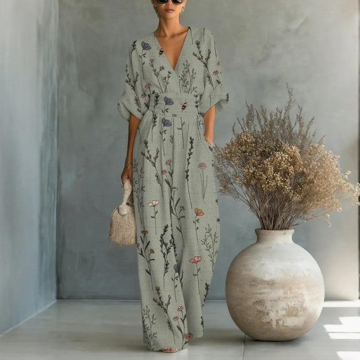 Women's waist-cinched V-neck printed wide-leg jumpsuit by FitiqueFit, featuring a casual style with a fitted waist and flowing legs.