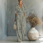 Women's waist-cinched V-neck printed wide-leg jumpsuit by FitiqueFit, featuring a casual style with a fitted waist and flowing legs.