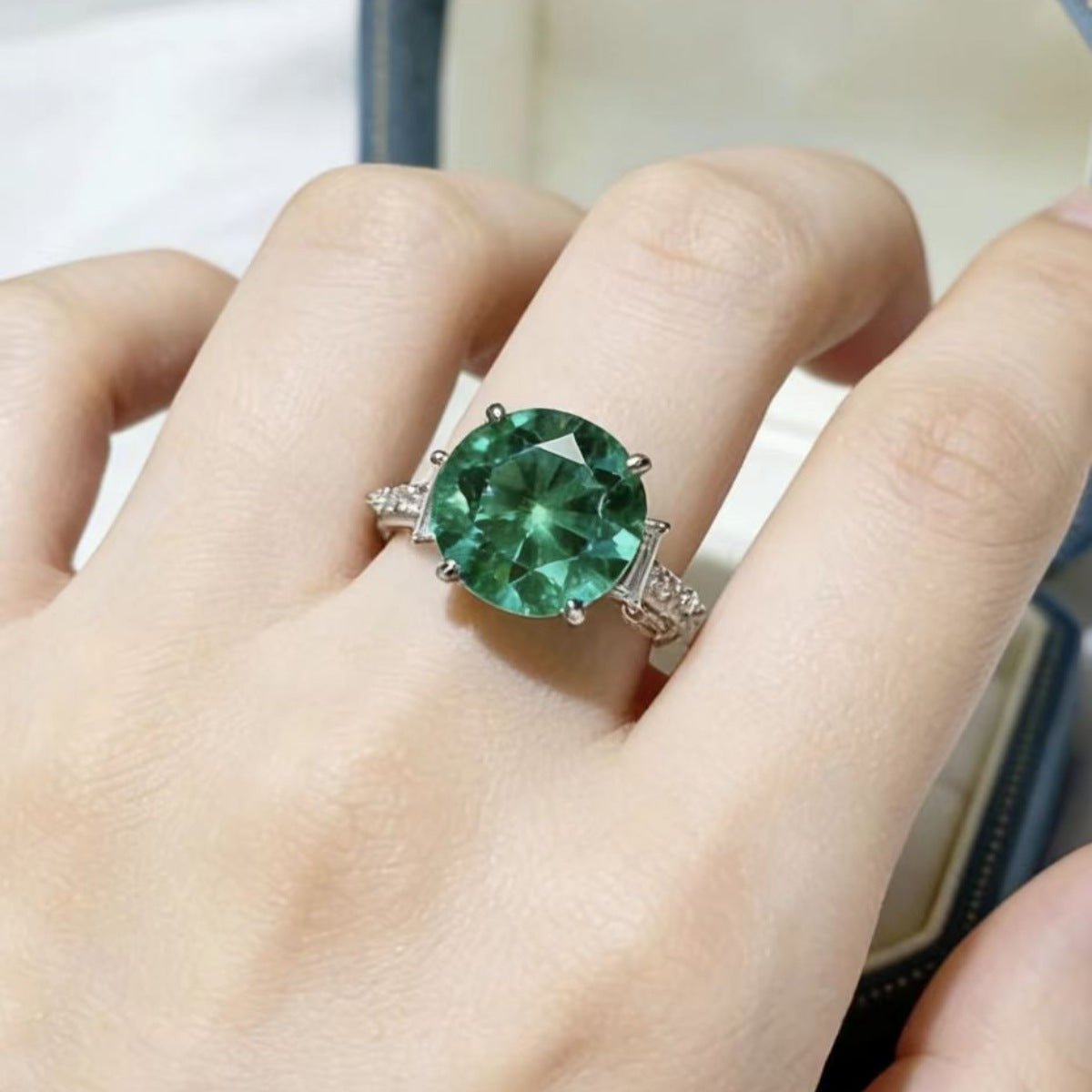 Sterling silver ring with an 8-carat moissanite gemstone, designed by Shopimist, showcasing a sparkling, elegant jewelry piece.