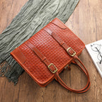 Women's hand-woven handbag made of vegetable-tanned full-grain leather cowhide, showcasing craftsmanship and natural leather texture.