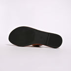Shopimist buckled leather slide sandals featuring a sleek design with wide straps and a comfortable flat sole.