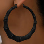 Stainless steel textured hoop earrings with a polished finish, crafted by Shopimist, displayed on a neutral background.