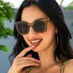 Large oversized women's sunglasses with bold black rims, fashionable eye wear by Plush Fashion Hub, perfect for a stylish look