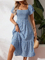 Floral print smocked ruffle sleeve midi dress by Trendsi, lightweight summer dress with feminine floral pattern and ruffle accents.