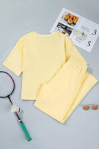 Plush Fashion Hub rings half sleeve top and drawstring pants set, featuring stylish jewelry and coordinated casual wear.