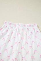 Simply Love bow print lettuce trim round neck top and shorts lounge set, featuring a playful bow pattern and comfortable fit.