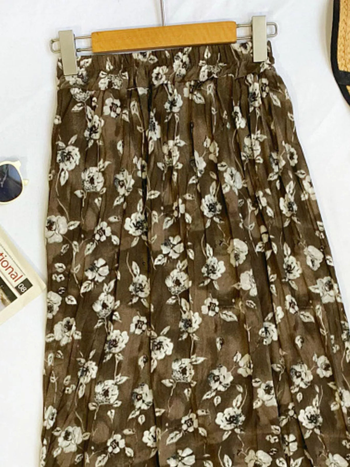 Floral print elastic waist midi skirt by Plush Fashion Hub, featuring lightweight fabric and a stylish flowy design.