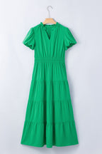 Women's ruffled tiered puff sleeve maxi dress by Plush Fashion Hub featuring an elegant floral pattern and flowing long skirt.