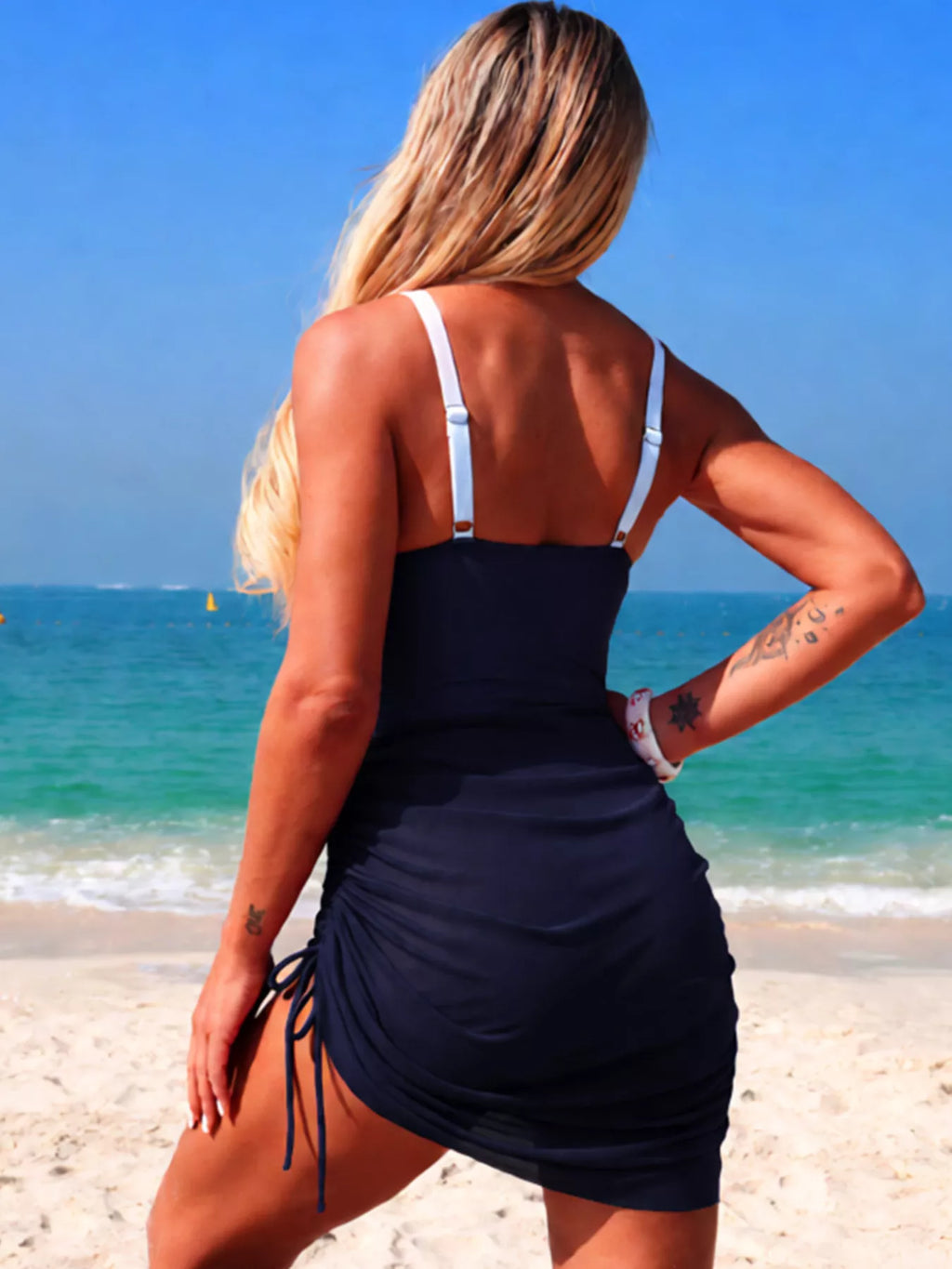 Women's color block cutout one-piece swimsuit by Trendsi, stylish beachwear with bold color blocking and flattering cutout design.