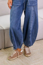 Plush Fashion Shop denim drawstring jeans with front and back pockets, relaxed fit, and classic blue denim fabric.