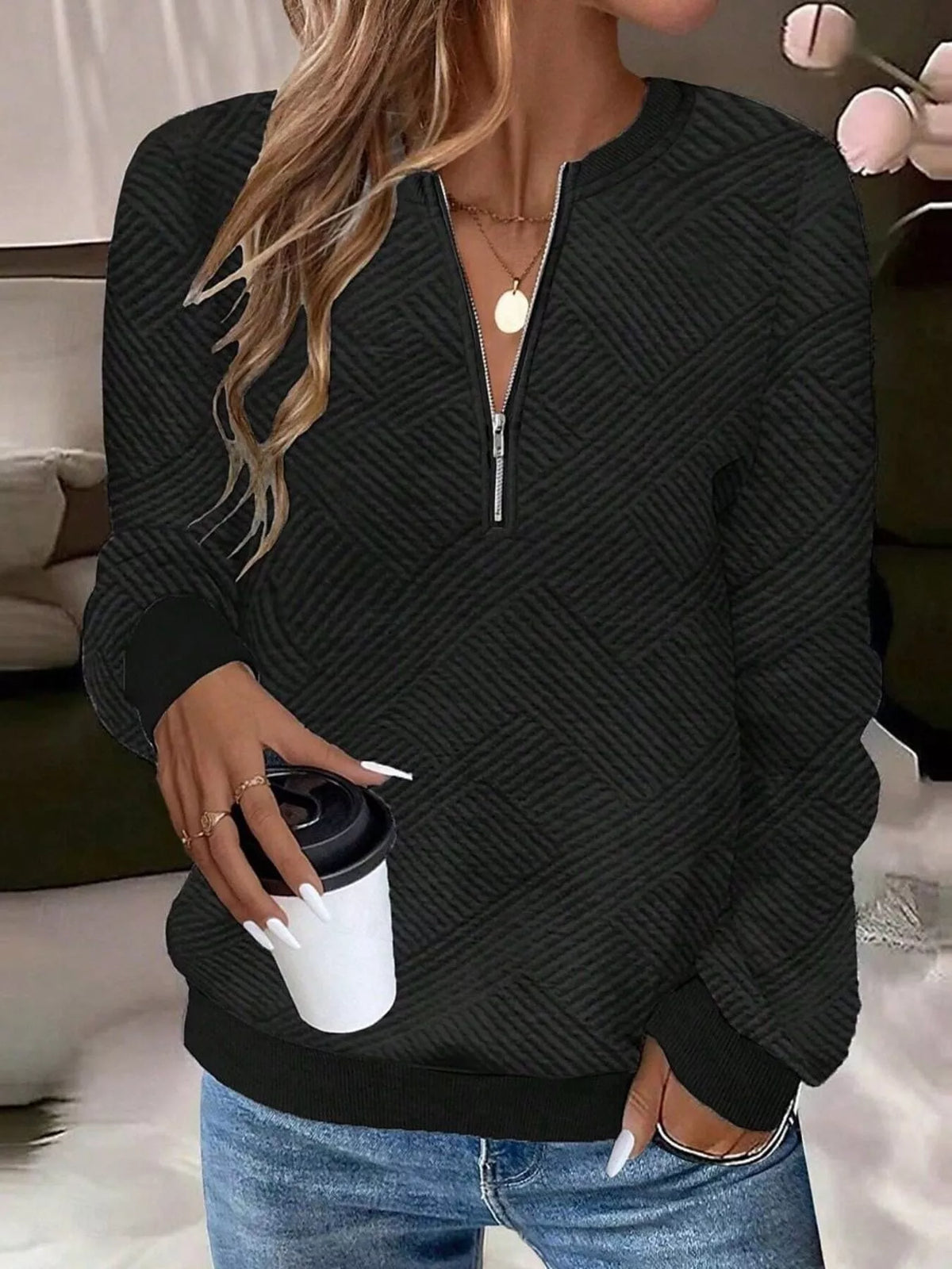 Textured women's quarter-zip sweatshirt by Trendsi, featuring a cozy fit and stylish design, shown in a close-up image.