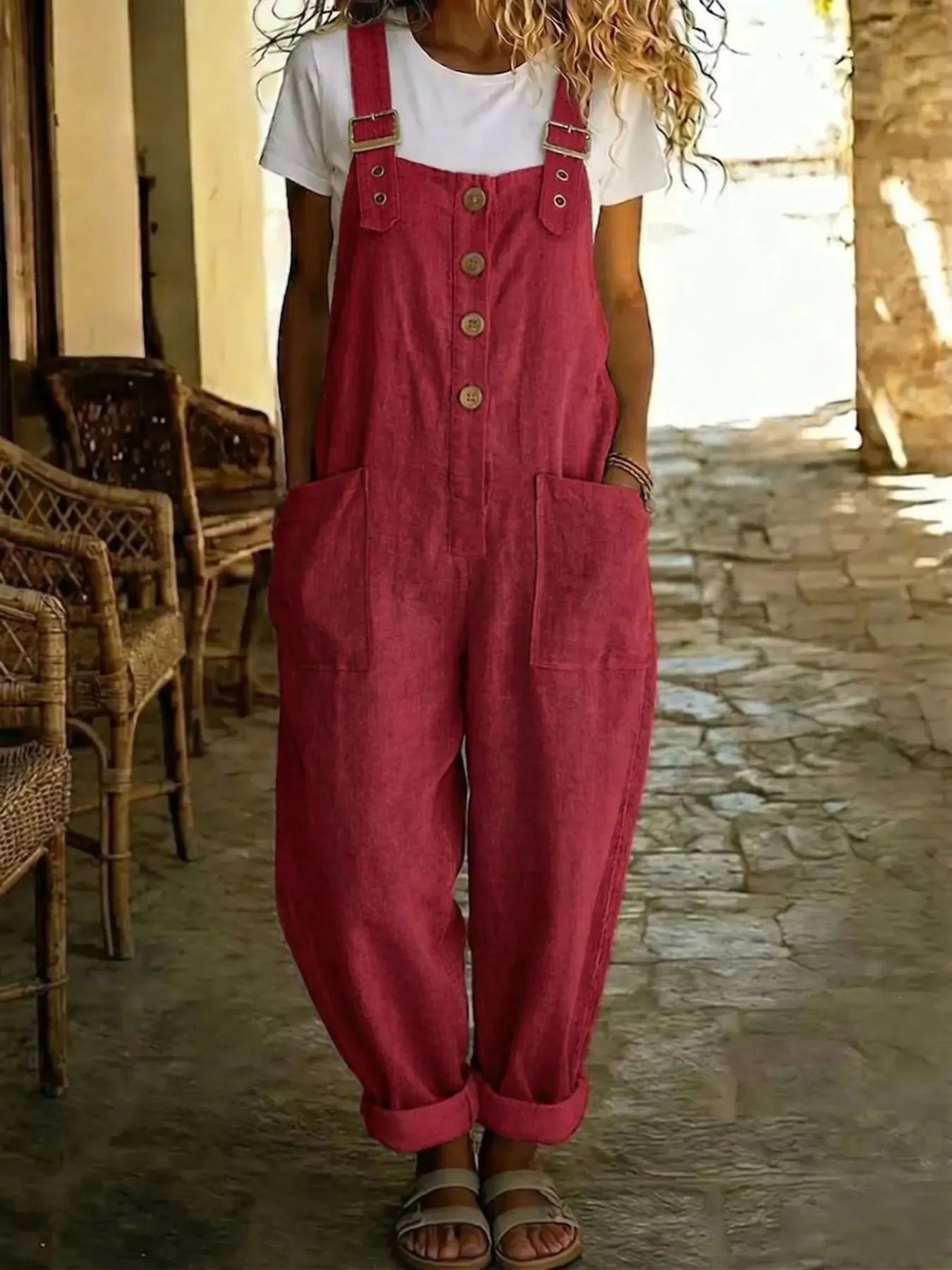 Casual button-front wide-leg overalls by Plush Fashion Hub, featuring adjustable straps and relaxed fit, shown on a model.