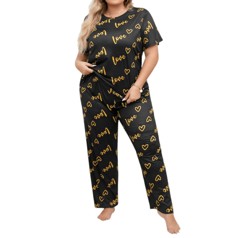 Black lounge set with yellow "love" text and heart pattern, short sleeves, round neck, loose fit pants.