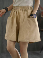 Light beige elastic waist casual shorts from Trendsi, featuring a relaxed fit and comfortable fabric for everyday wear.