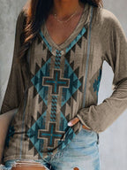 Plus size geometric print V-neck long sleeve T-shirt by Trendsi, featuring a casual style with vibrant geometric patterns.