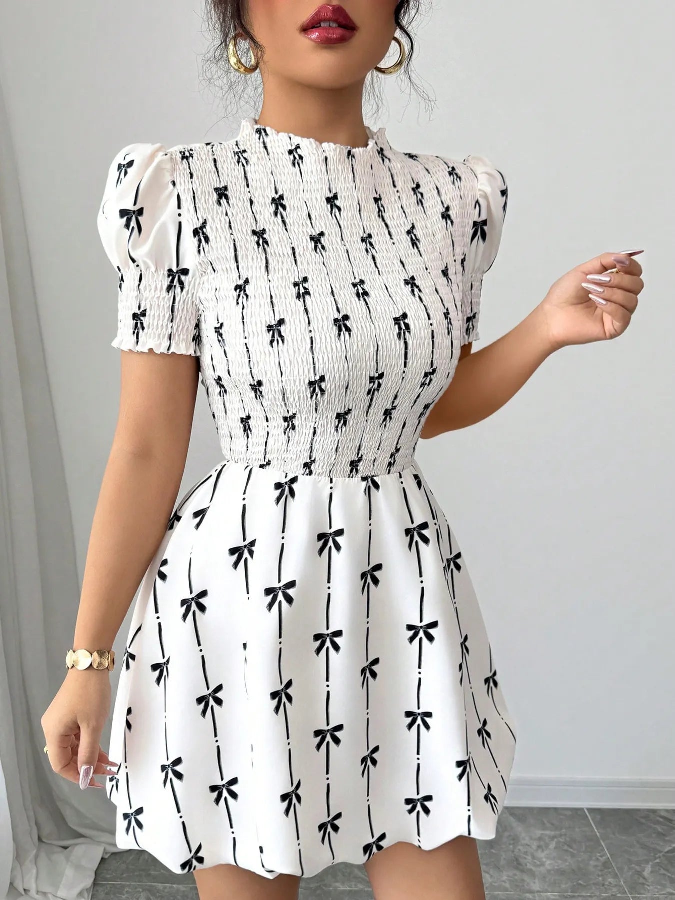 Short sleeve smocked bow print dress by Plush Fashion Hub featuring a fitted bodice and playful bow accents.