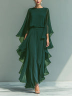 Elegant two-piece women's outfit featuring ruffle-edged wide-leg pants and a long sleeve top from Plush Fashion Hub.